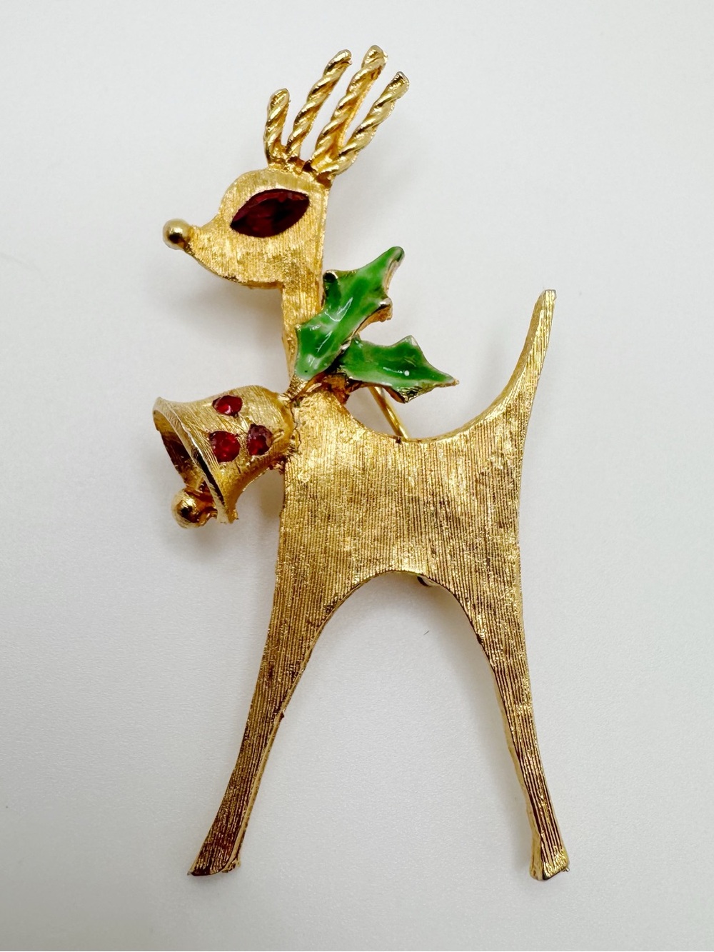 Vintage MYLU Gold-tone Reindeer Brooch with Green Holly and Red Accents